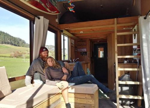 Couple turn rusty boat trailer into transportable home